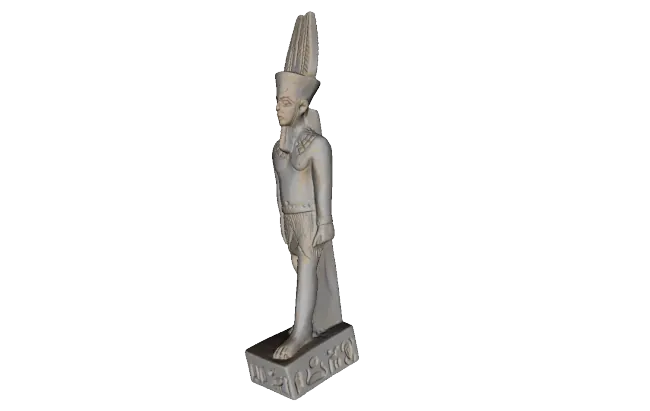 Figura impresa en 3D de un faraón, vista de perfil sobre fondo blanco, con los pliegues y relieves del modelo visibles